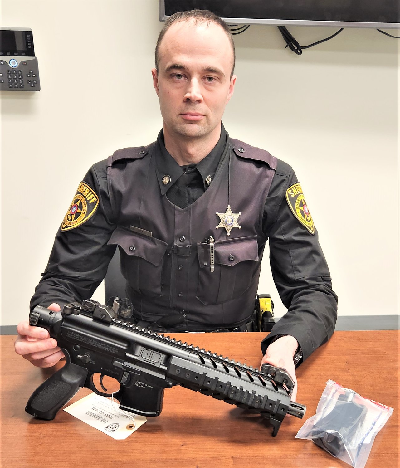 Deputy Charles Stackhouse displays the BB gun that was confiscated.